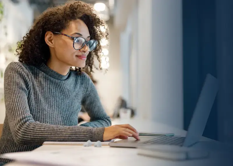 developer using the giftbit gift card api on her laptop