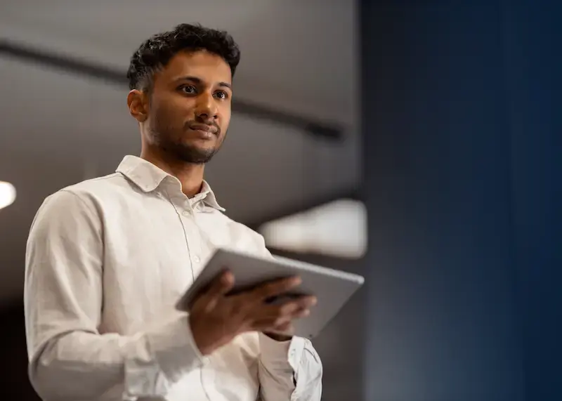 Salesman using the Giftbit platform on his tablet.