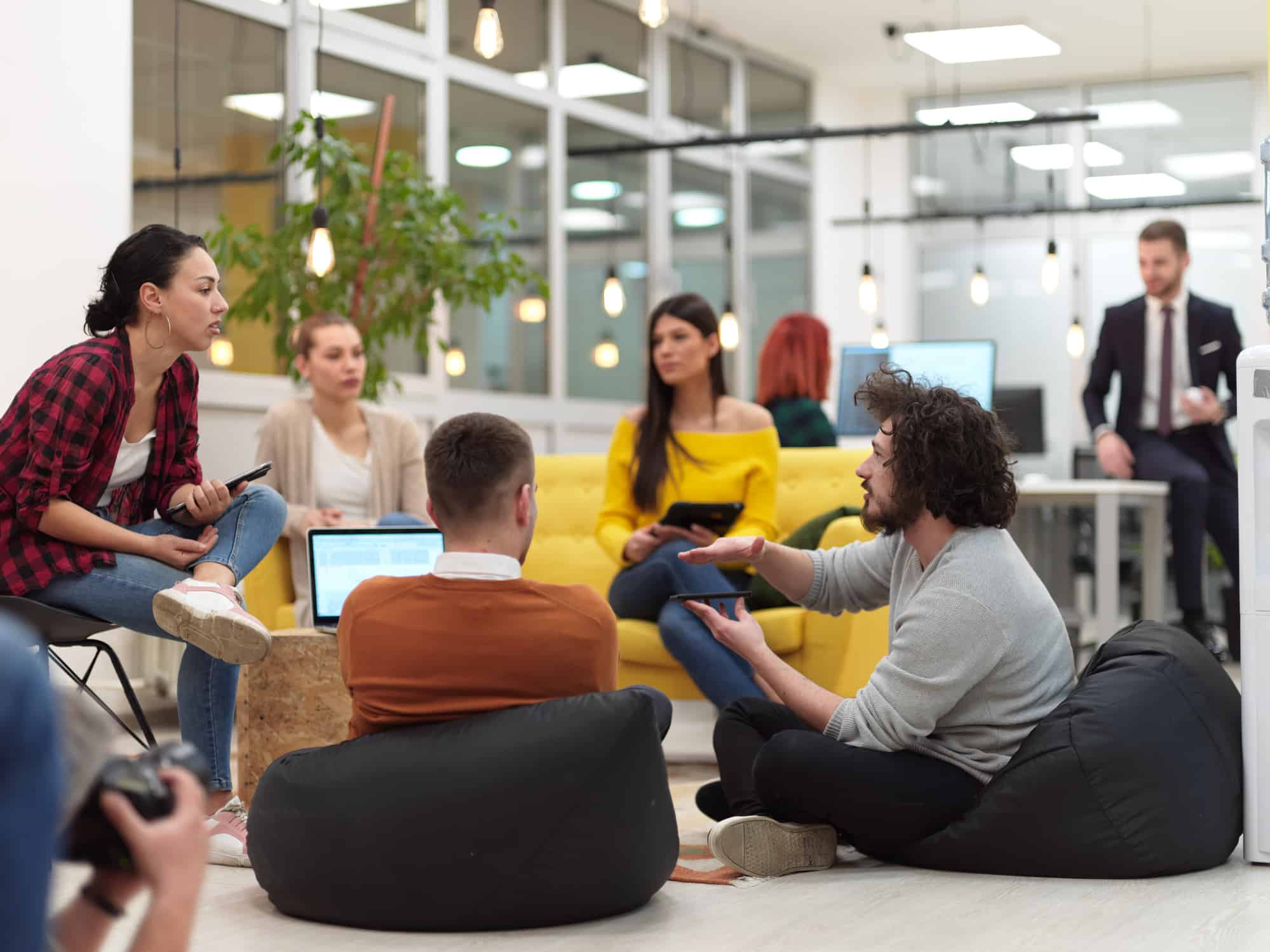 Engaged and productive employees in the office having a meeting.