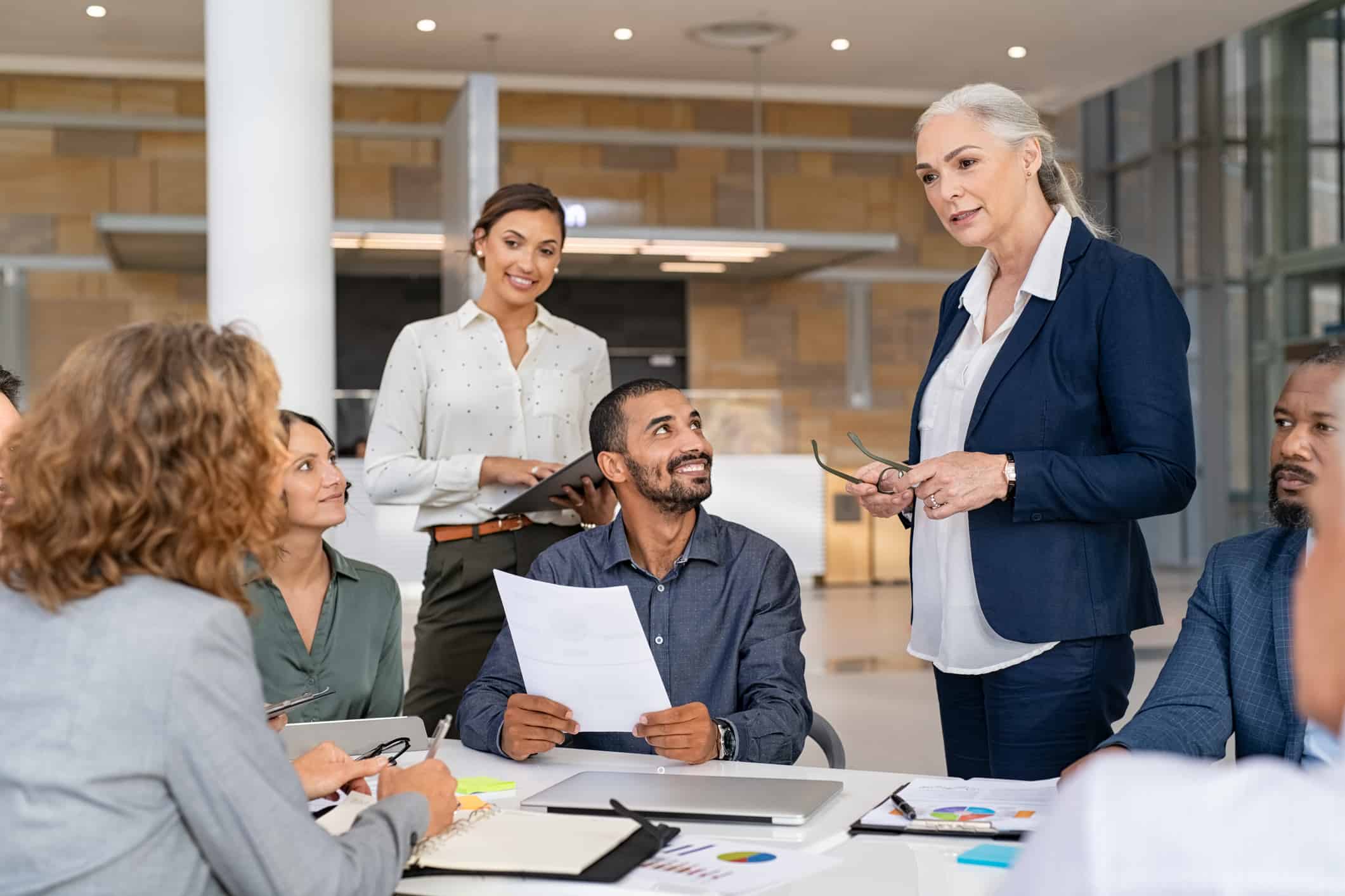 A group of employees discussing how to best automate their rewards program