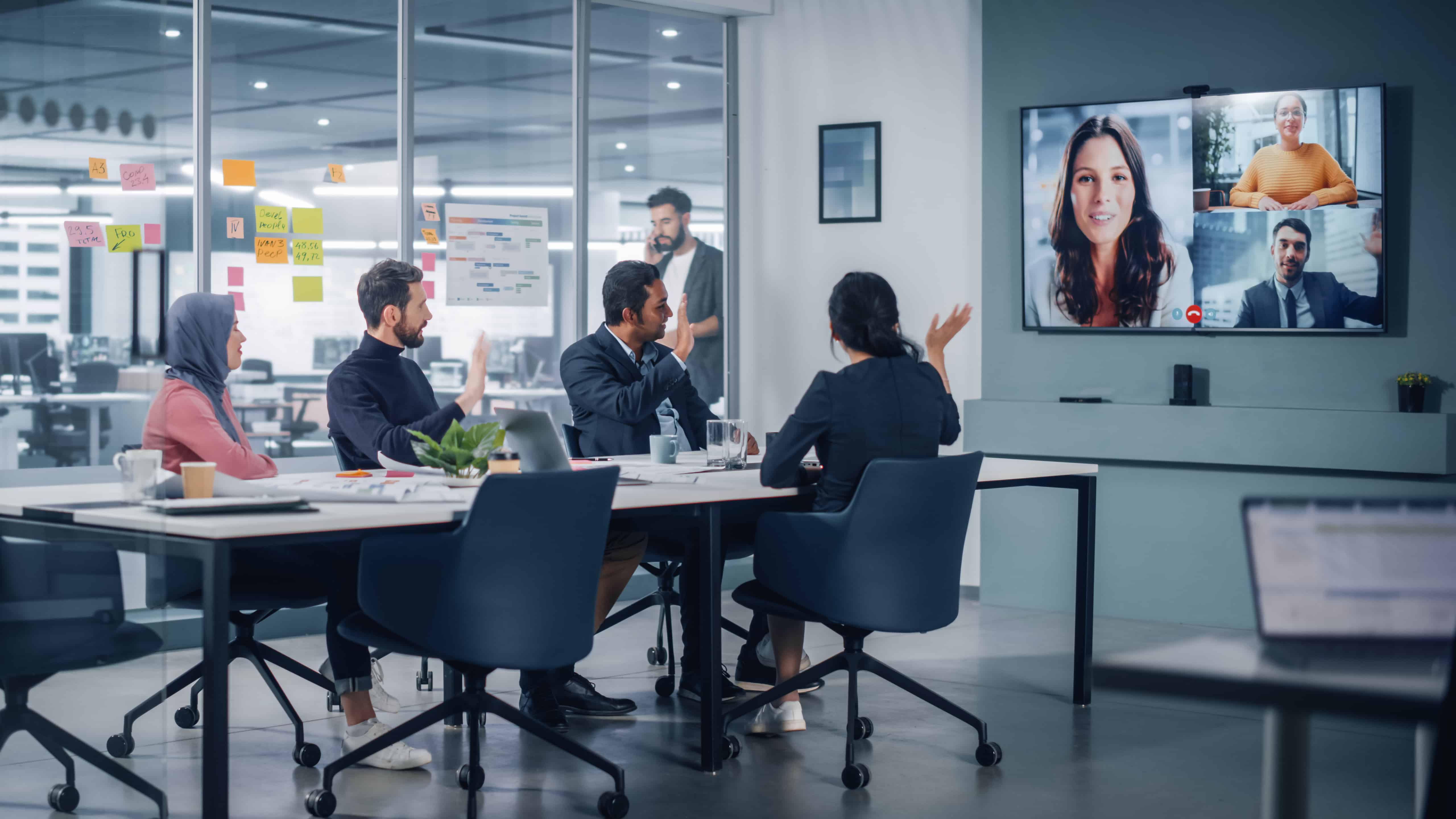 Employees in a video conference meeting or call at the office.